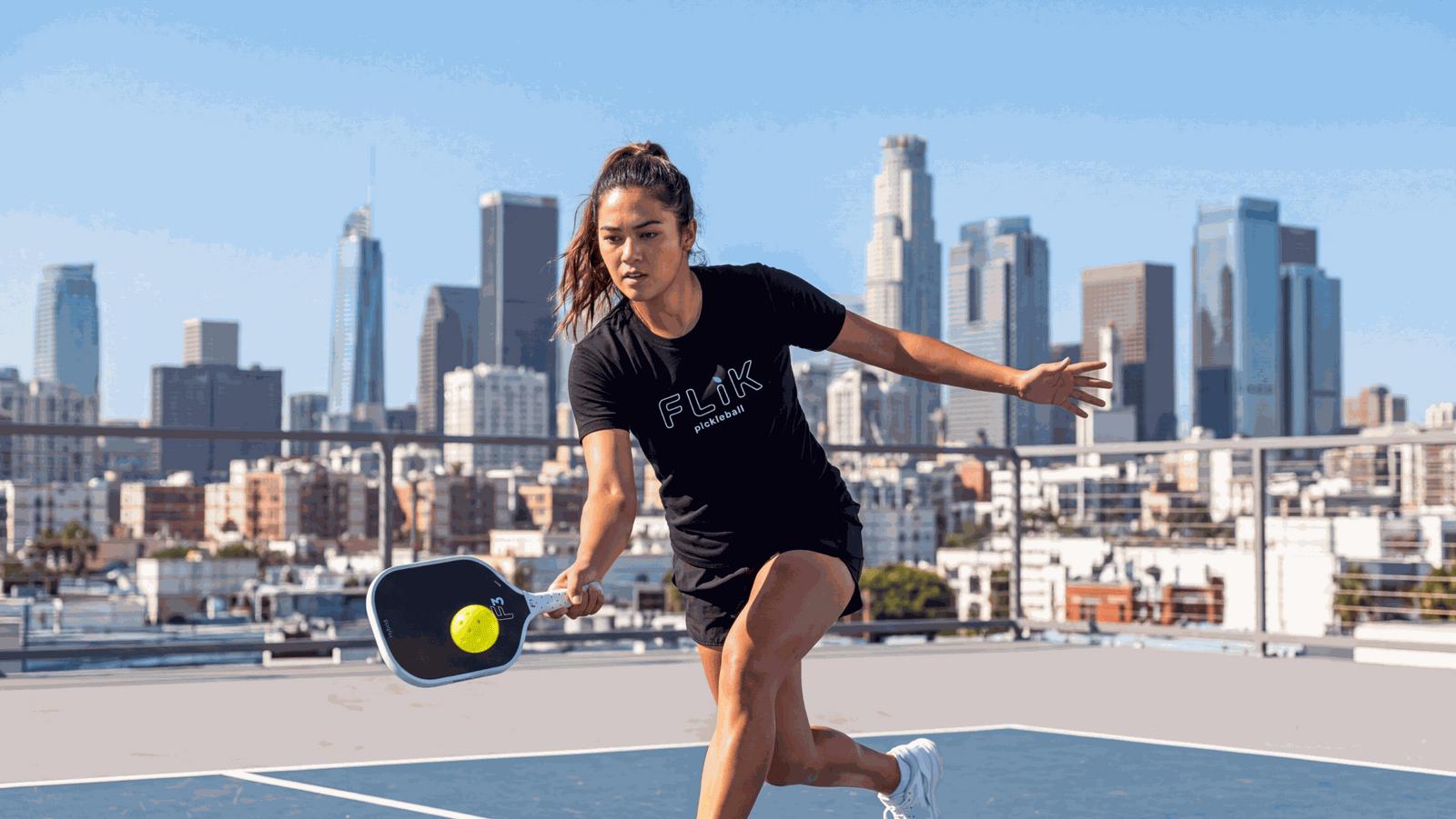 Female Pickleball player hitting forehand