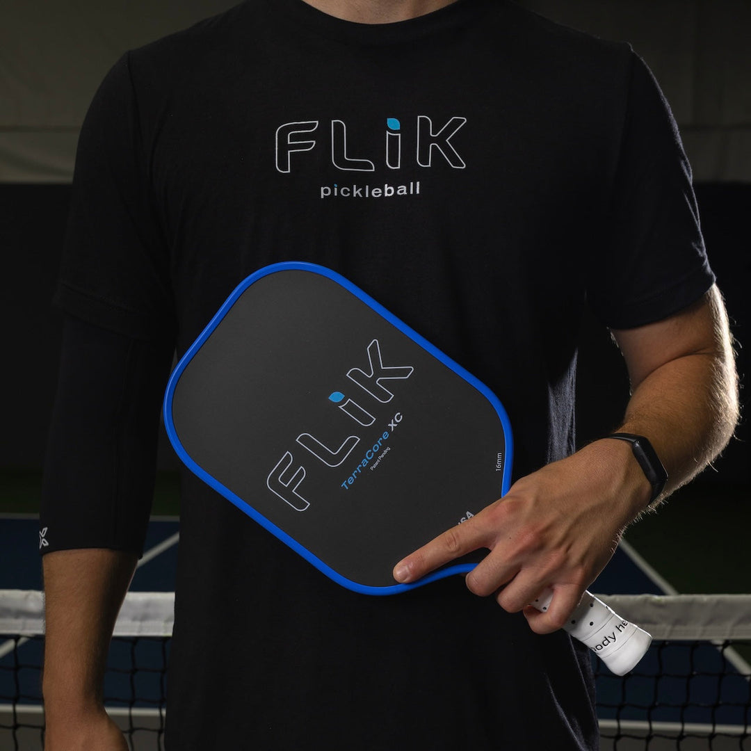 Alec holding a body helix FLIK F1 TeerraCoreXC USAP Approved pickleball paddle