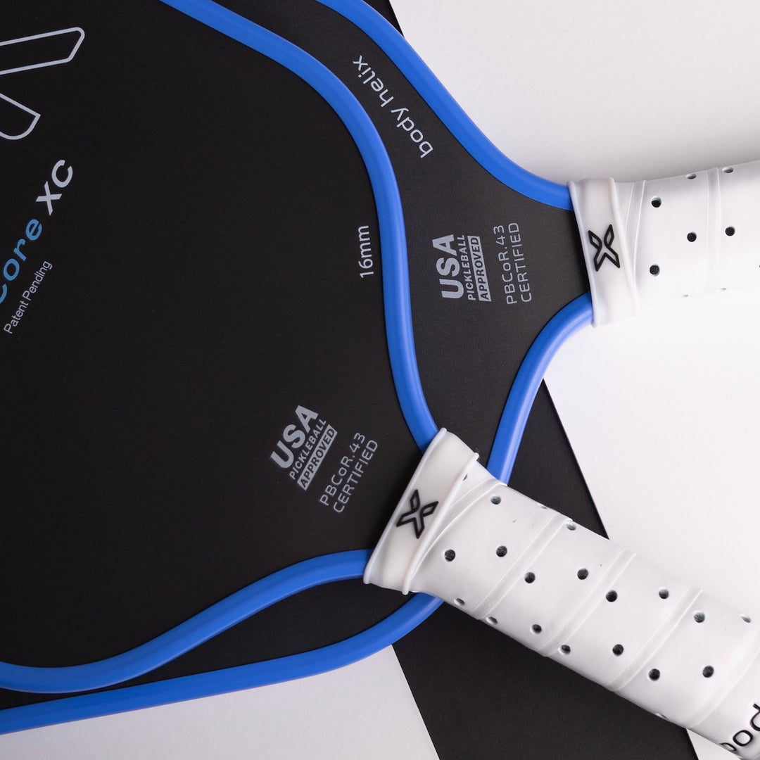 Close-up of a paddle with 'USA Paddle Certified' branding on a black background
