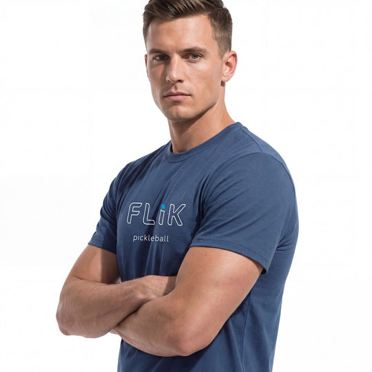 Man wearing a blue 'Flik pickleball' t-shirt on a white background