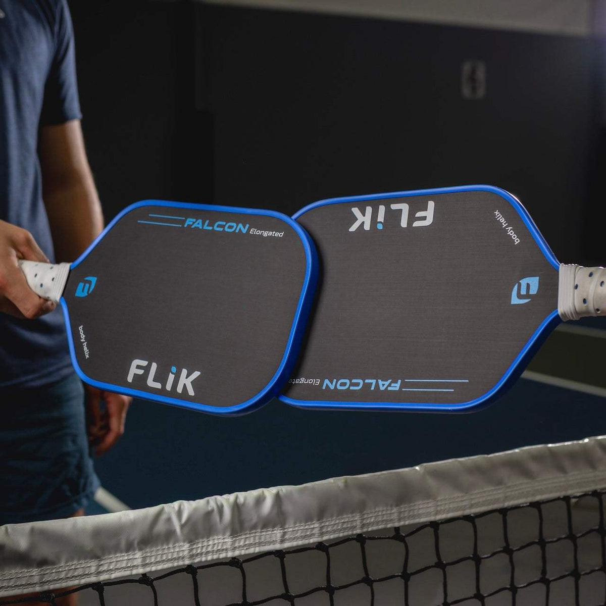 FLiK Falcon All-Court Paddle with elongated shape, carbon fiber face, and cork inserts for precision and shock mitigation