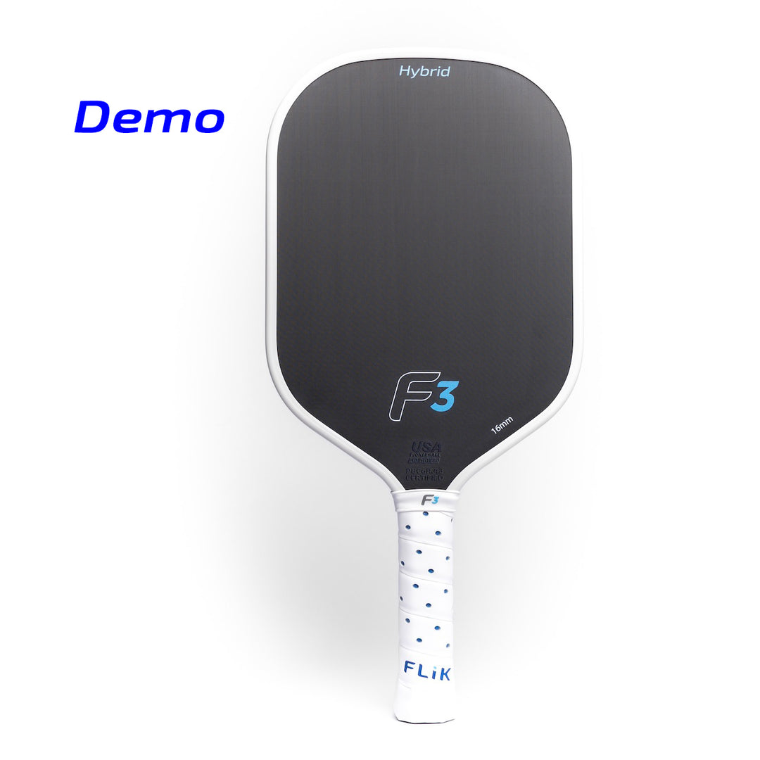 Pickleball paddle with black face and white handle on a white background