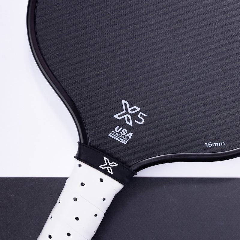 Close-up of a body helix x5 pickleball paddle with branding on a white background