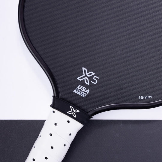 Close-up of a body helix x5 pickleball paddle with branding on a white background